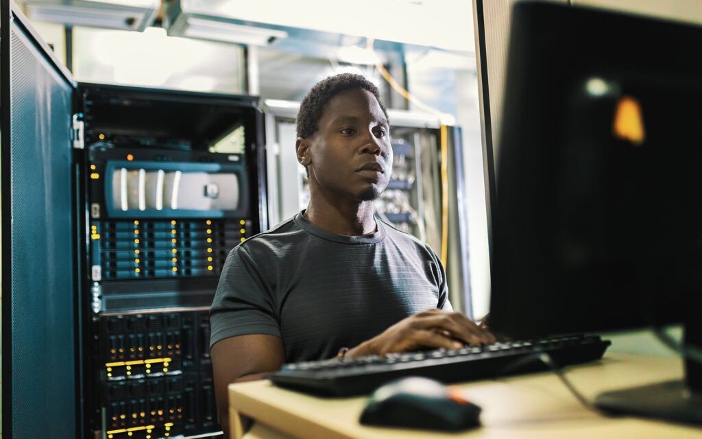 Technician working at a server rack