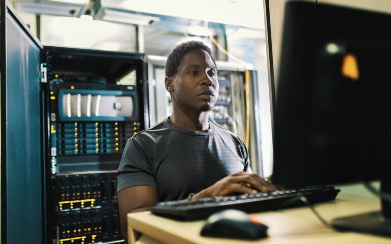 Technician working at a server rack